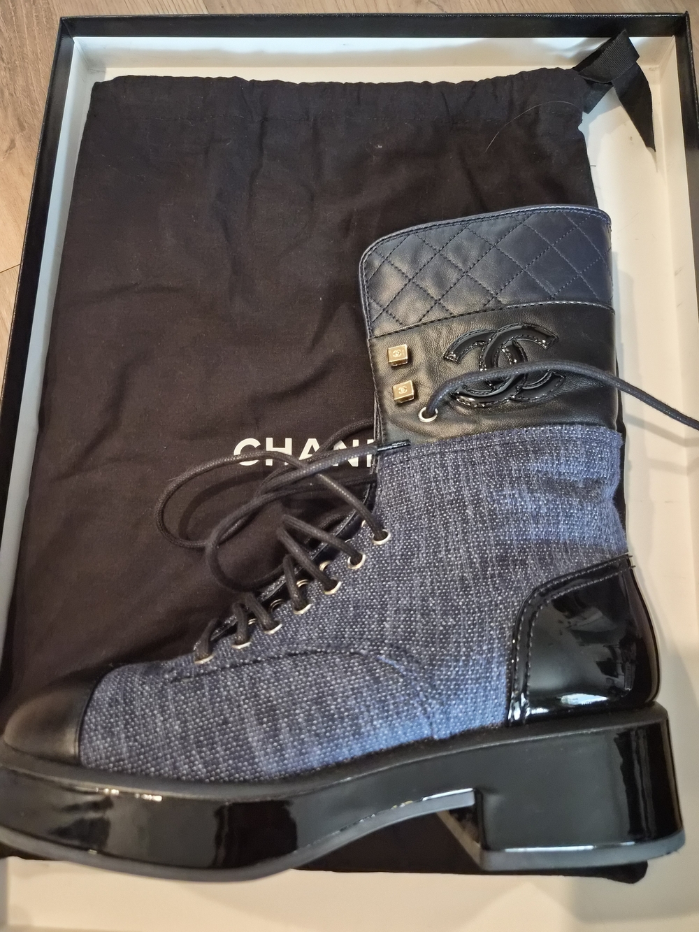 CHANEL Navy Quilted Lace-Up Combat Boot with Patent Accents